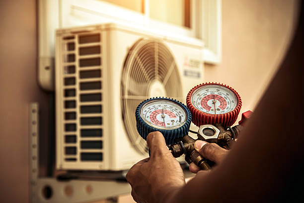 Professional Air Conditioning Service technician working in Quincy, IL